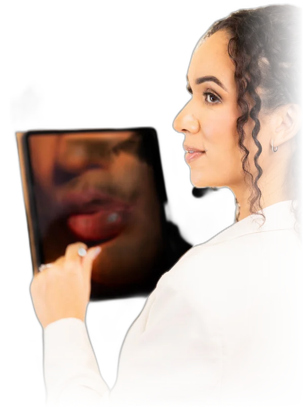 Cassie reviewing a lip plan on a tablet